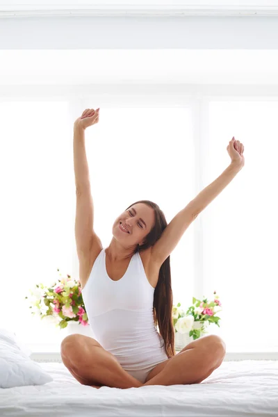 A young women stretching after waking up — Stock Photo, Image