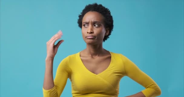 Bored woman making blah blah gesture with hand — Stock Video