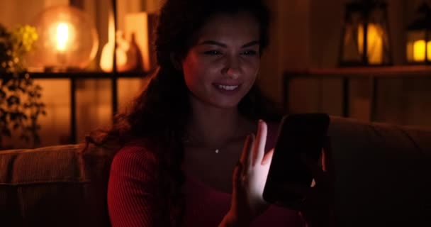 Woman using mobile phone late night at home — Stock Video