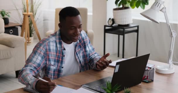 Man using laptop for video conference at office — Video Stock