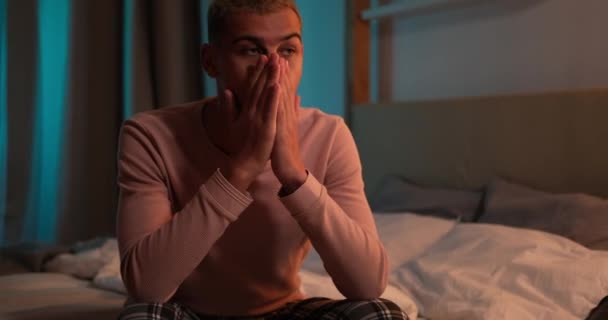 Man suffering from depression sitting on bed — Stock Video