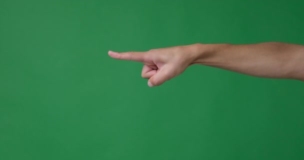 緑の背景に手を指差す — ストック動画