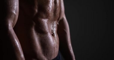 Muscular man sweating after workout
