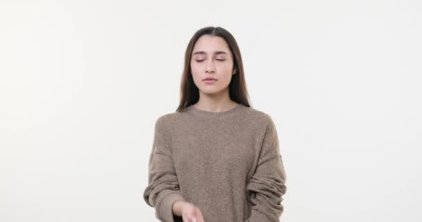 Woman regretting her deeds over white background — Stock Video