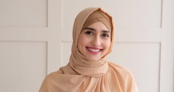 Portrait of muslim woman smiling at home — Stock Video