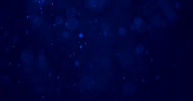 Yüzen mavi bokeh ışığı ve toz parçacıkları