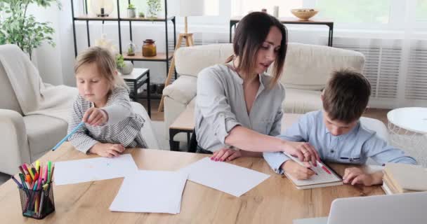 Mother helping children with homework — Stock Video