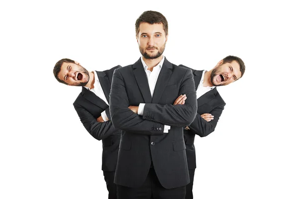 Men behind confident young businessman — Stock Photo, Image