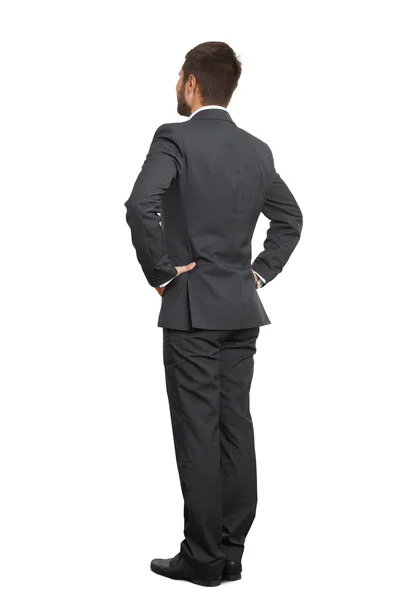 Man in black suit with hands on belt — Stock Photo, Image