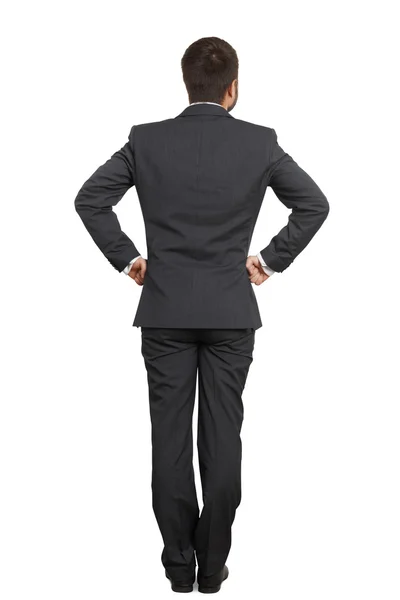 Man in suit with hands on belt — Stock Photo, Image