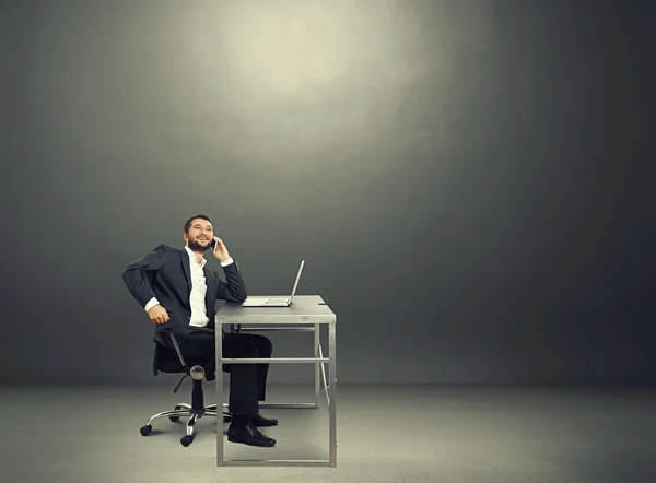 Businessman in the dark room — Stock Photo, Image