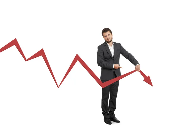 Broker pointing at falling down graph — Stock Photo, Image