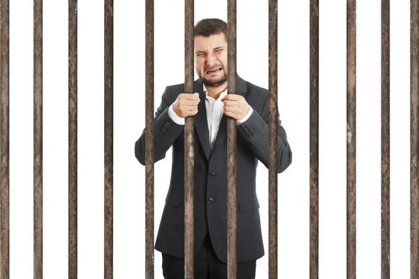 Homem de negócios atrás da cela da prisão — Fotografia de Stock