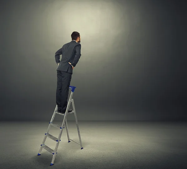 Businessman in black suit standing — Stock Photo, Image