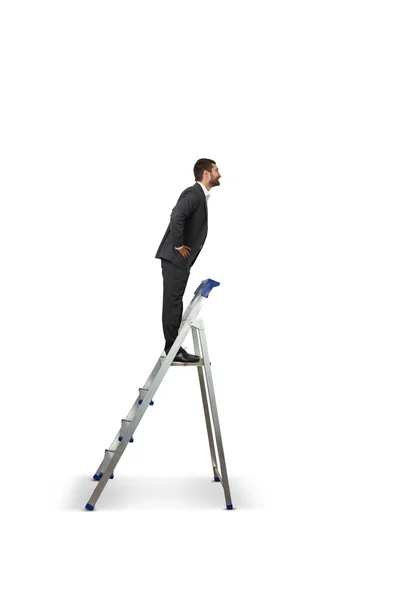 Businessman standing on the stepladder — Stock Photo, Image