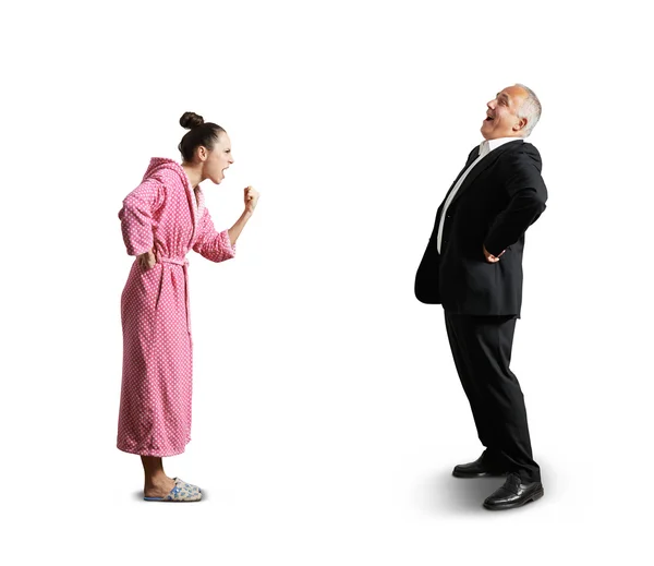 Woman showing fist laughing man — Stock Photo, Image