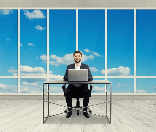 Smiley businessman in light office — Stock Photo, Image