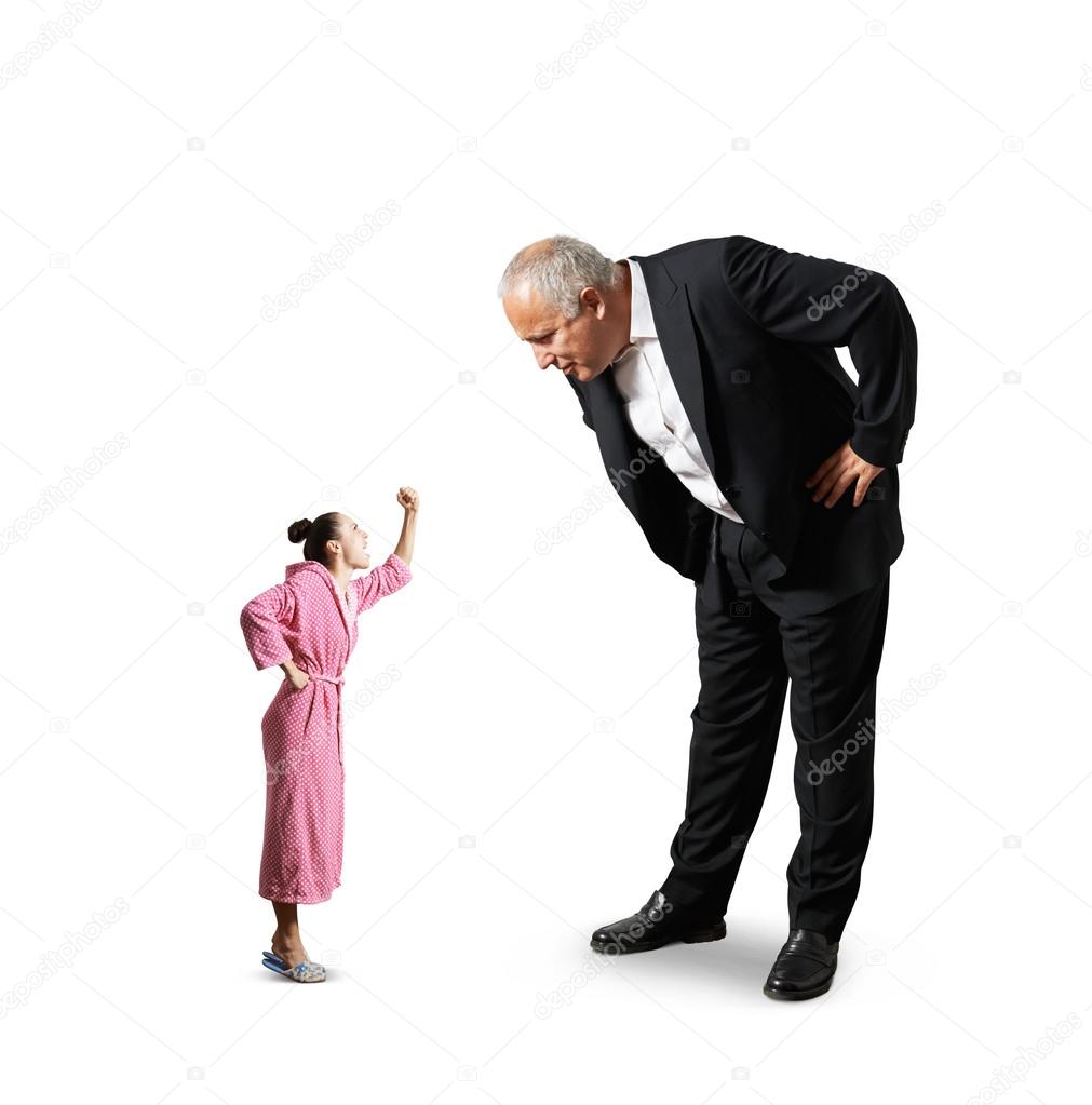 man looking at small screaming woman