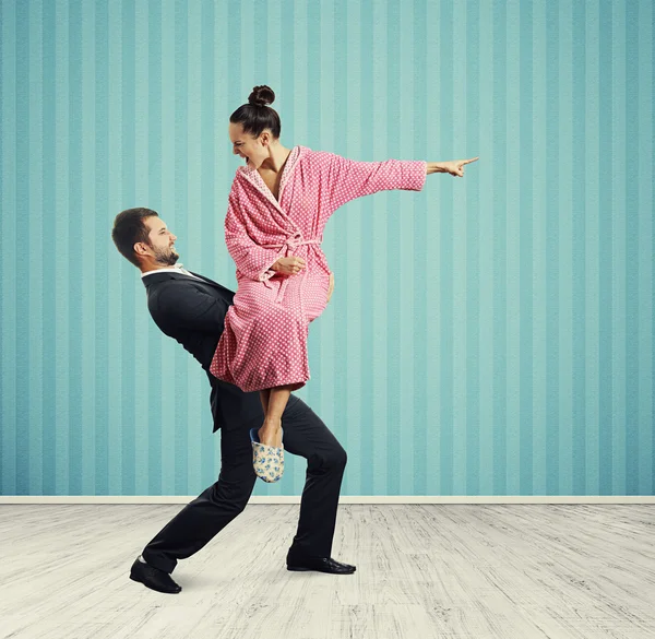 Man holding angry young wife — Stock Photo, Image