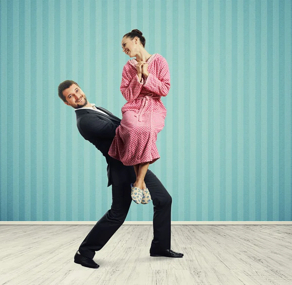 Man holding his excited wife — Stock Photo, Image