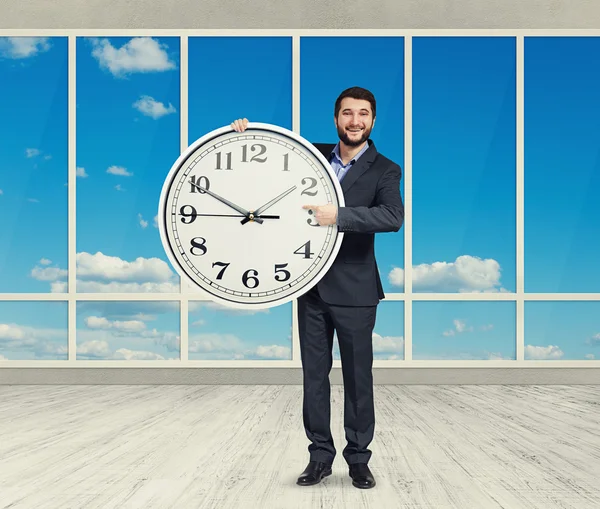 Man with big white clock standing — Stock Photo, Image