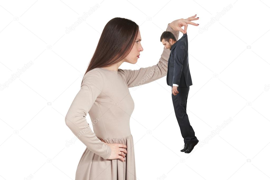 woman looking at small man