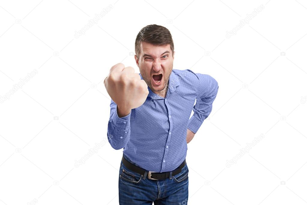 man showing big fist and screaming