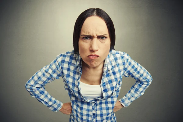 Displeased woman over dark — Stock Photo, Image