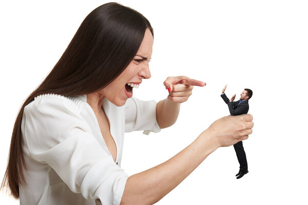yelling woman pointing at small scared man