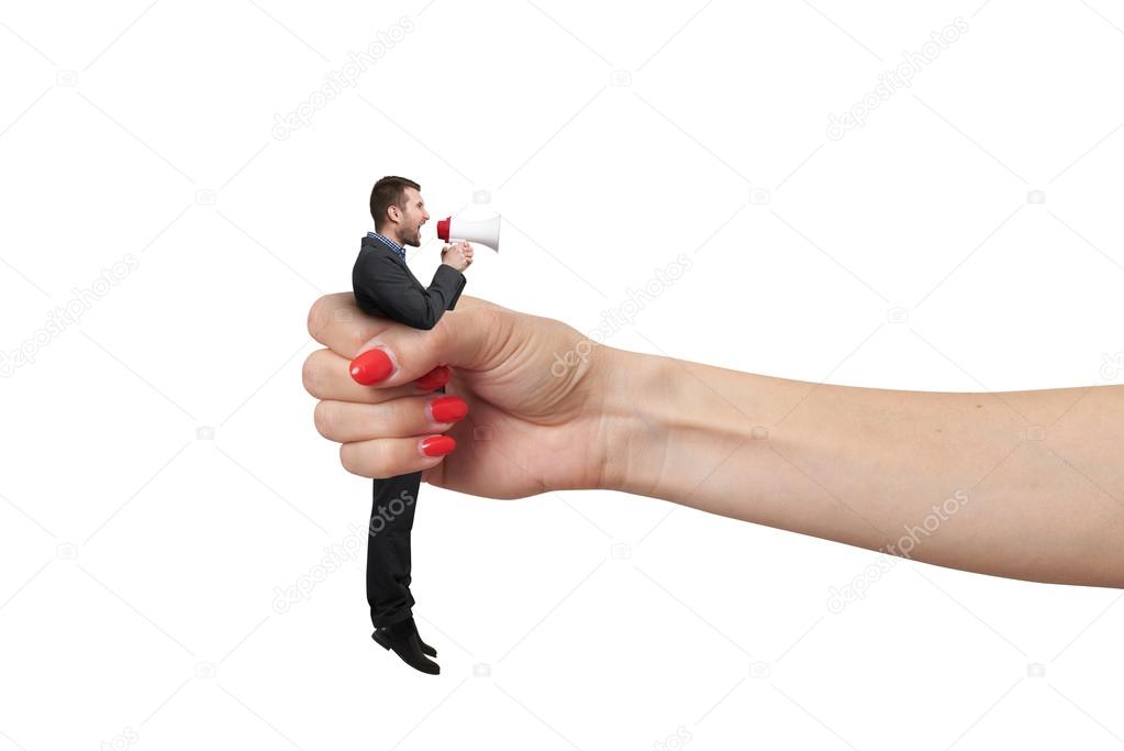 hand holding in fist small man