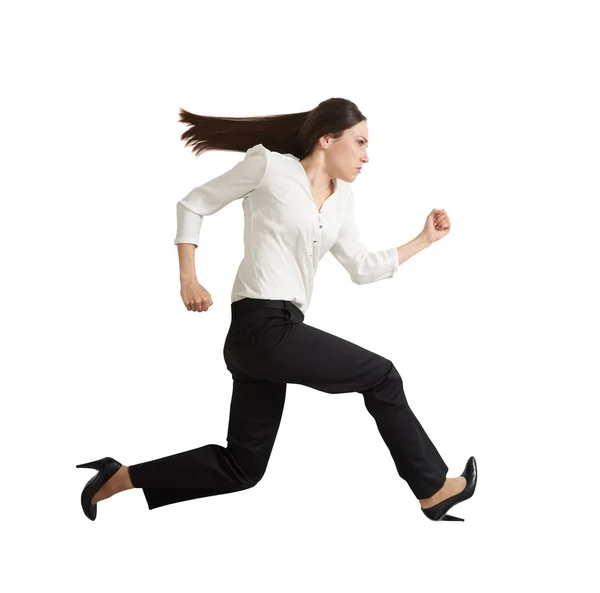 Concentrated running businesswoman — Stock Photo, Image