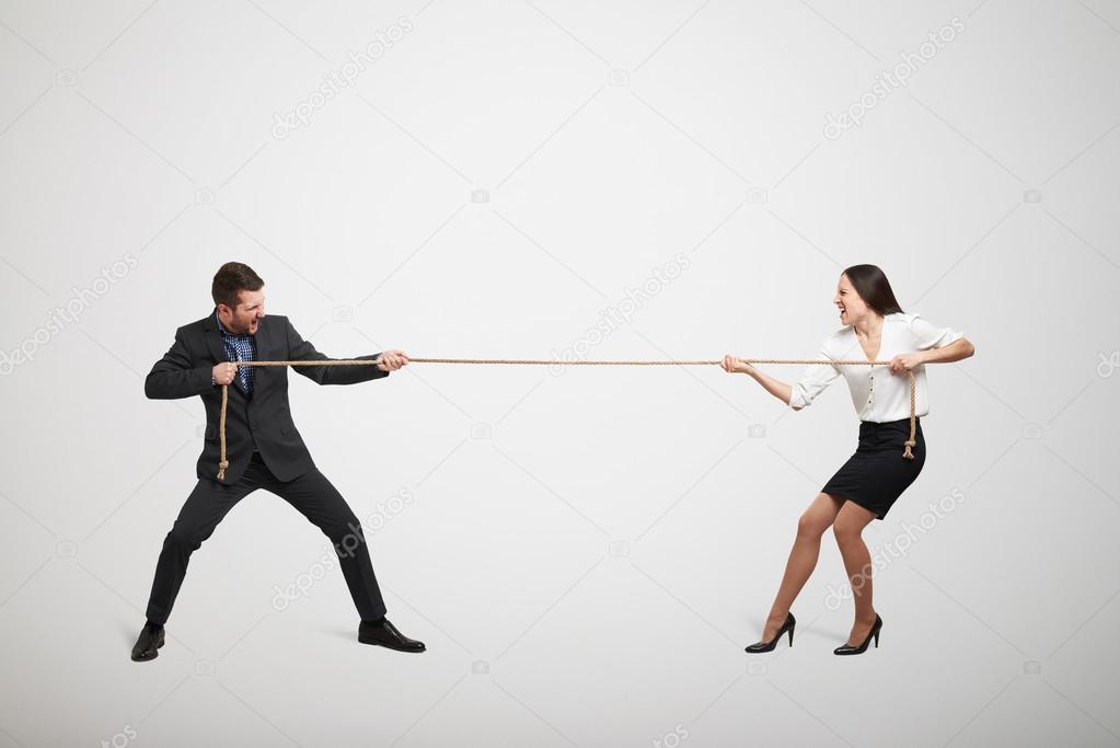 woman and man pulling the rope