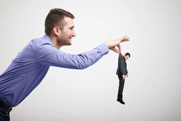 Sideview of smiley man holding — Stock Photo, Image