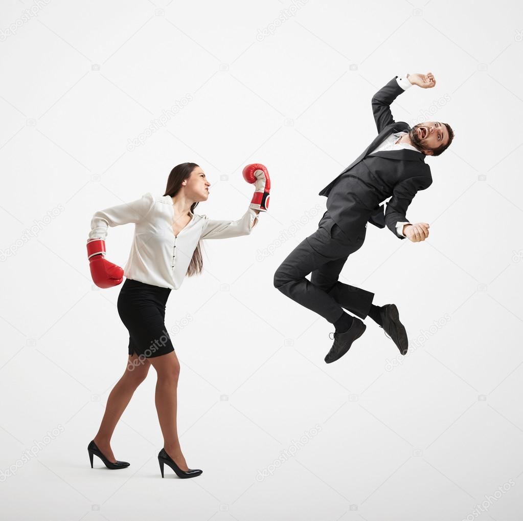 angry woman punching businessman