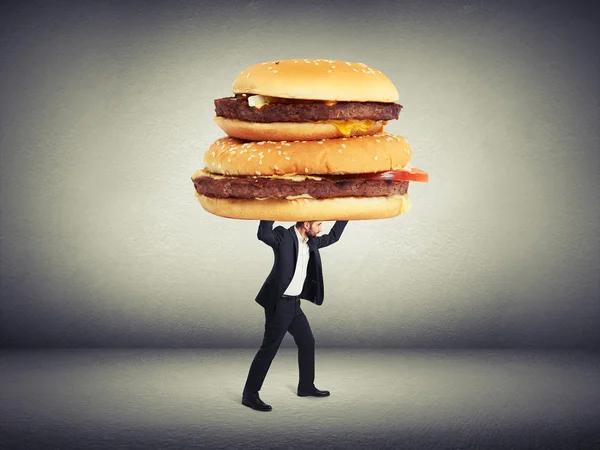 Hombre llevando grandes sándwiches —  Fotos de Stock