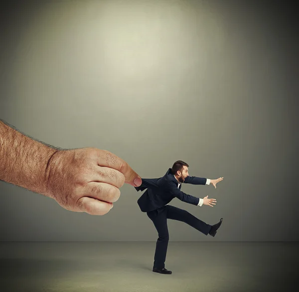 Hand kepping emotional running businessman — Stock Photo, Image