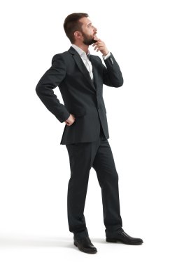 thoughtful businessman in formal wear