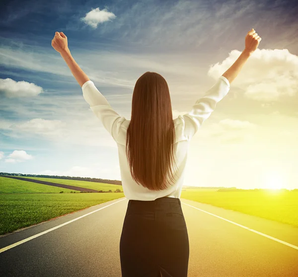 Happy woman raising hands up — Stok fotoğraf