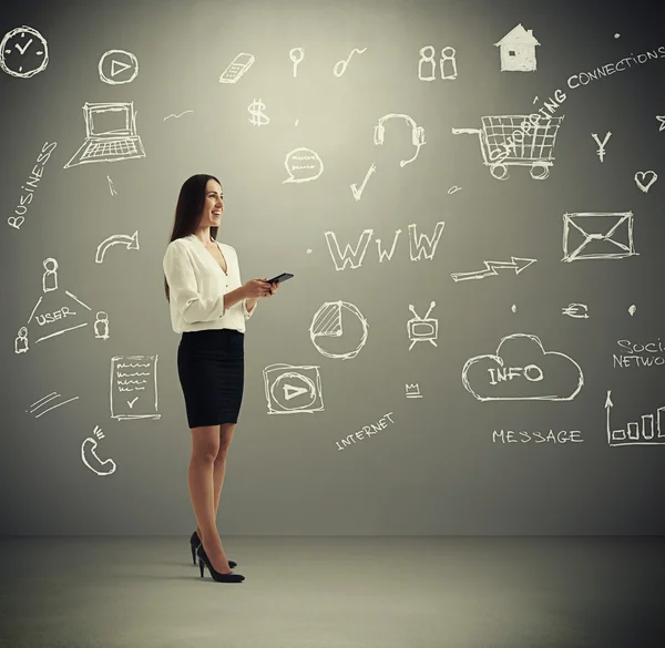 Woman looking at graphic signs — Φωτογραφία Αρχείου