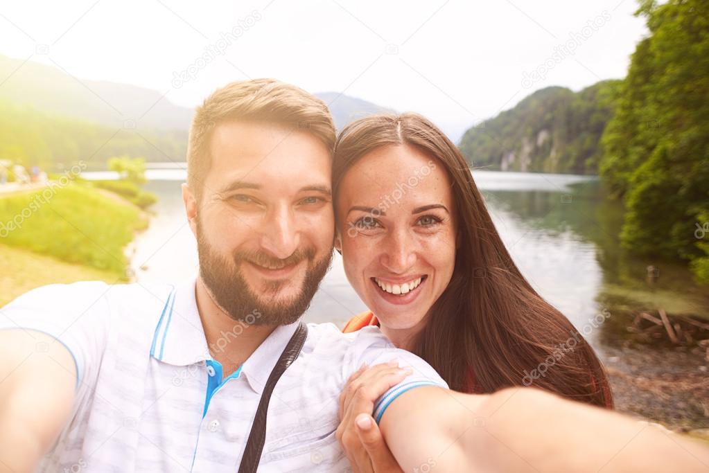 smiley couple taking selfie
