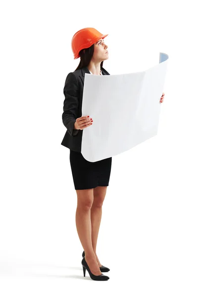 Woman in hardhat holding blueprint — Stock Photo, Image