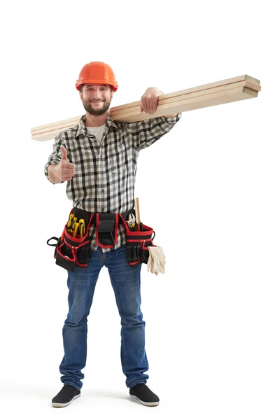 Builder in uniform showing thumbs up — стоковое фото