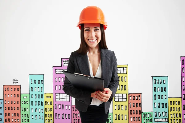 Businesswoman over drawing cityscape — Stock Photo, Image