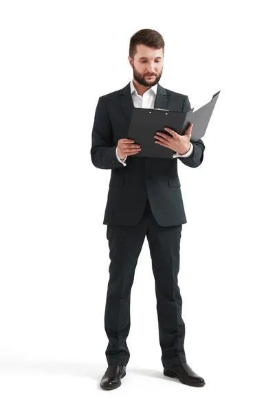Man in formal wear reading documents — Stock Photo, Image