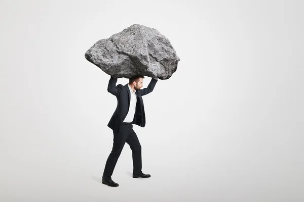 Carrying big stone — Stock Photo, Image