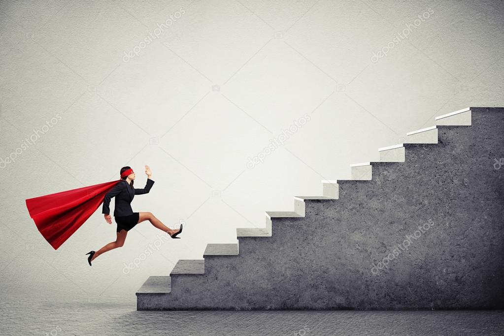 superwoman in red cloar running up stairs