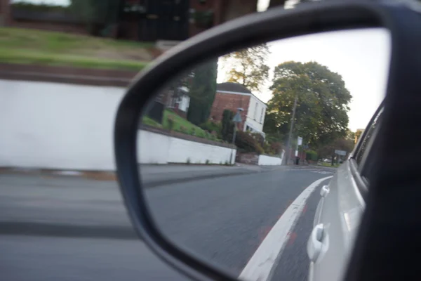 Wing mirror images through moving vehicle — Stock Photo, Image