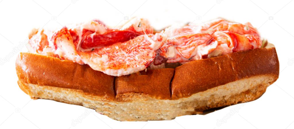 Horizontal view of a fresh made tasty Maine lobster roll sandwich isolated.