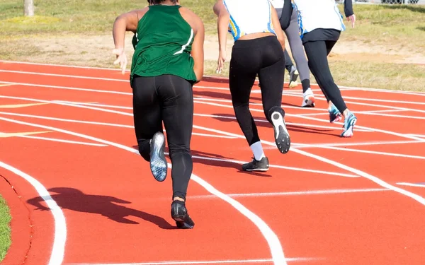 Rear View High School Girls Starting Sprint Race Outdoor Track — стоковое фото
