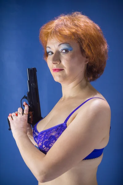 Woman with gun Royalty Free Stock Images